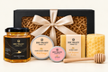 Six-piece Dee Valley gift box with wildflower honey, body cream, lip balm, soap, beeswax candle and dipper