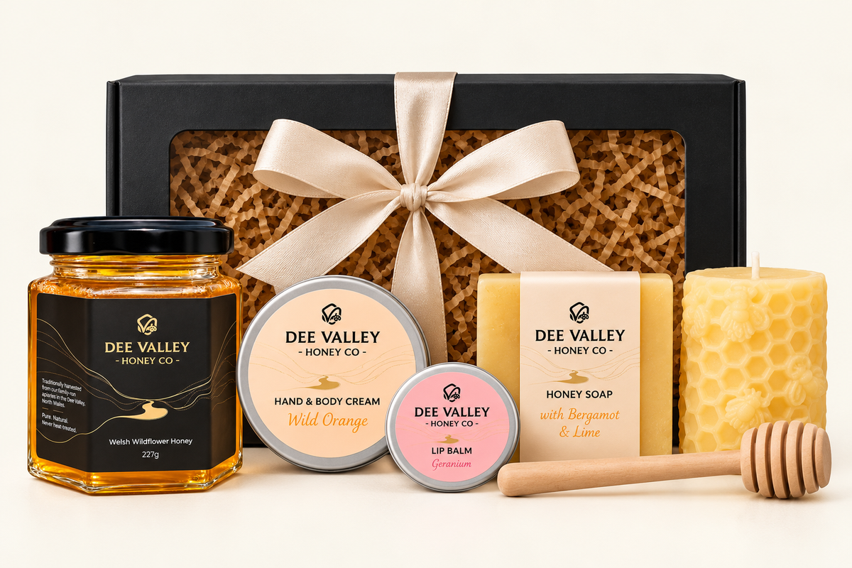 Six-piece Dee Valley gift box with wildflower honey, body cream, lip balm, soap, beeswax candle and dipper